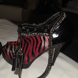 Dollhouse stilettos red black and white tiger stripes.